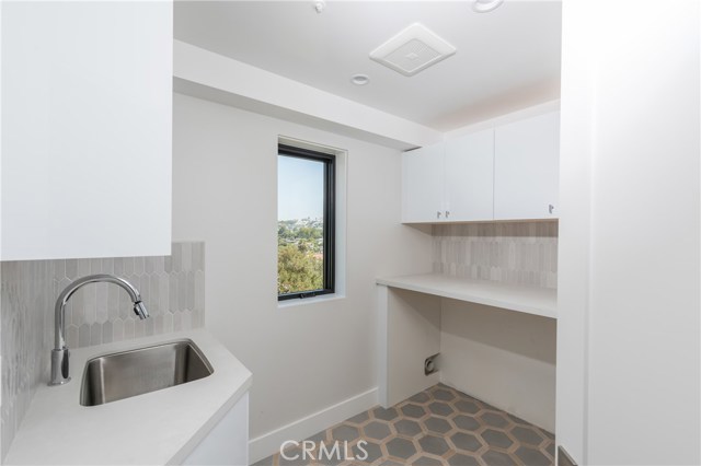 Laundry room with sink