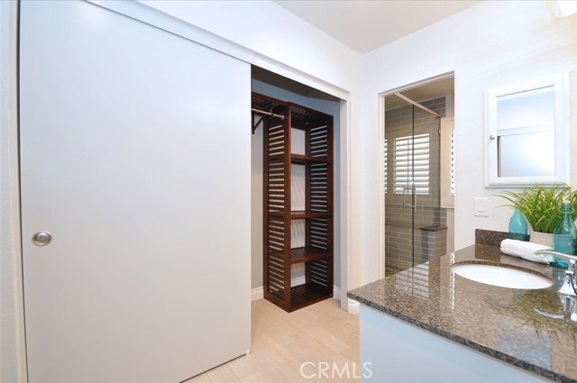 Custom closet organizers in the Master bedroom dressing area.