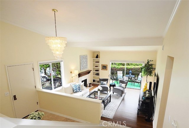 View from upper Family Room overlooking Living Room and Outdoor Patio.