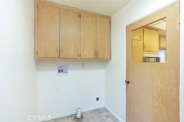 Inside Laundry Room with Space for Full-Size Washer & Dryer