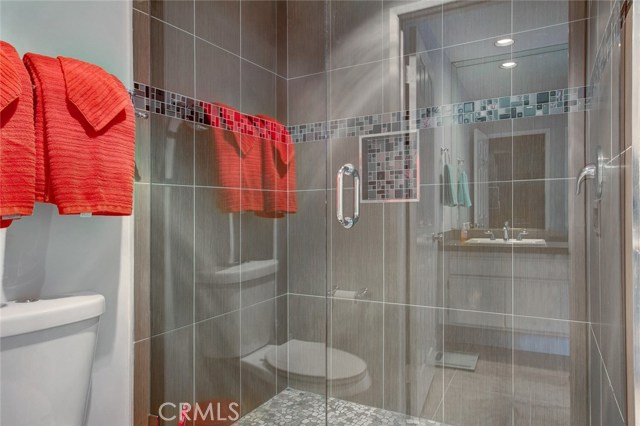 Master bath with custom glass shower doors.