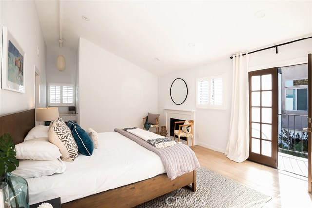 MASTER BEDROOM FEATURES FIREPLACE AND PRIVATE BALCONY GREAT FOR SOAKING IN THE SUN!
