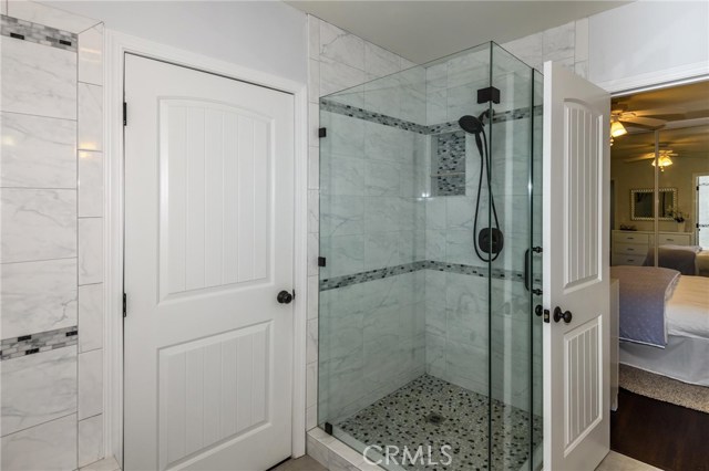 Hallway bathroom has separate shower and deep tub.