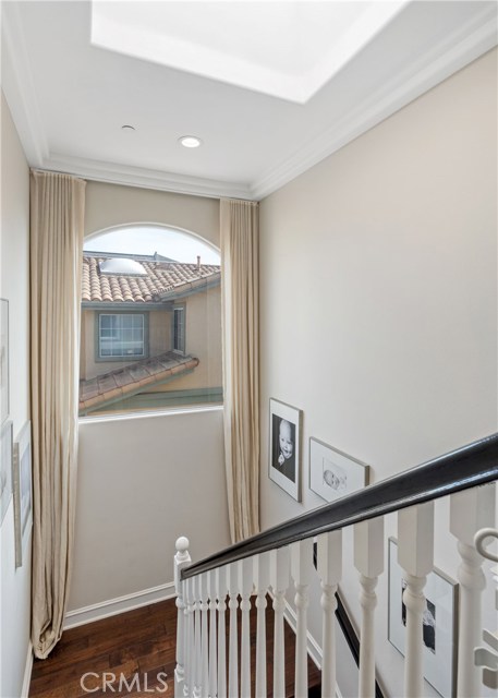 Hardwood floors from top to bottom.  Skylight and large windows allow for even more light!