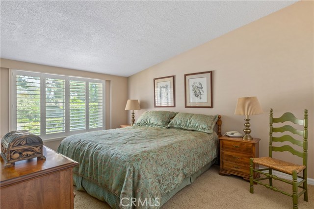 Master Bedroom with Plantation Shutter.  Newer Large Window overlooking the Front Yard.