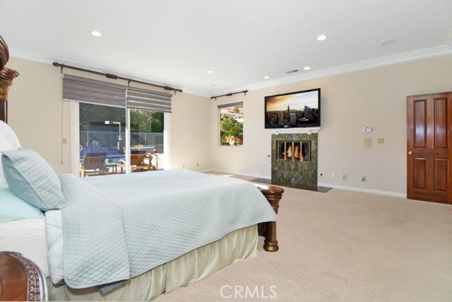 Master Bedroom with Fireplace (virtually staged)