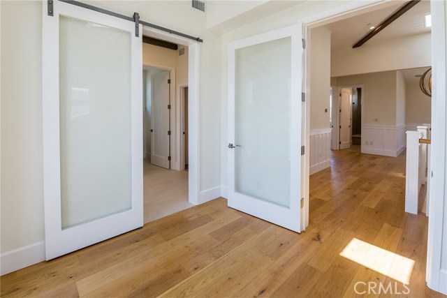 Barn doors lead to Master bathroom from Vestibule and on the other side to the bedroom itself.