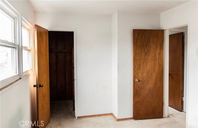 Bedroom that faces front of the home.  Walk-in closet.