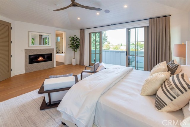 Primary bedroom #1 - beautiful fireplace and nice deck too. Remote control shades - just touch a button.