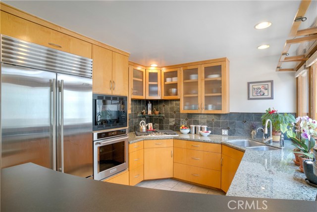 Just to the left of the refrigerator is a double pullout pantry.