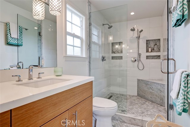 Master bath features designer tile and fixtures.