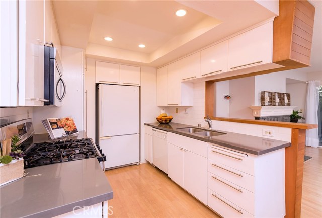 Upgrades include: cabinet doors, countertops and backsplash