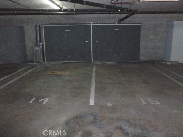 2 side by side parking spaces and storage cabinets in front