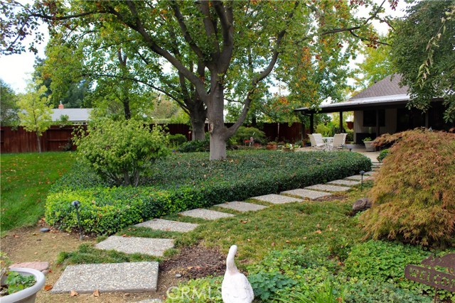 Steps from the storage and plane shed to back patio and Koy pond