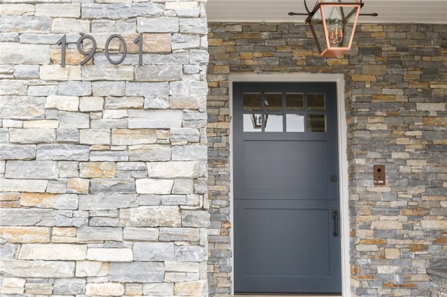 stacked stone, copper lighting, dutch door