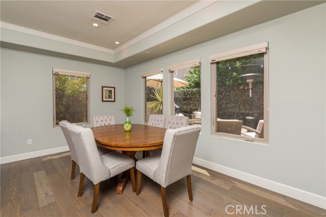 Warm and welcoming formal dining area looks out to the lovely rear yard!