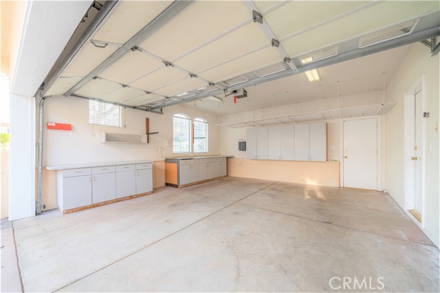 Attached garage, with extra storage and access to side, back and front yard