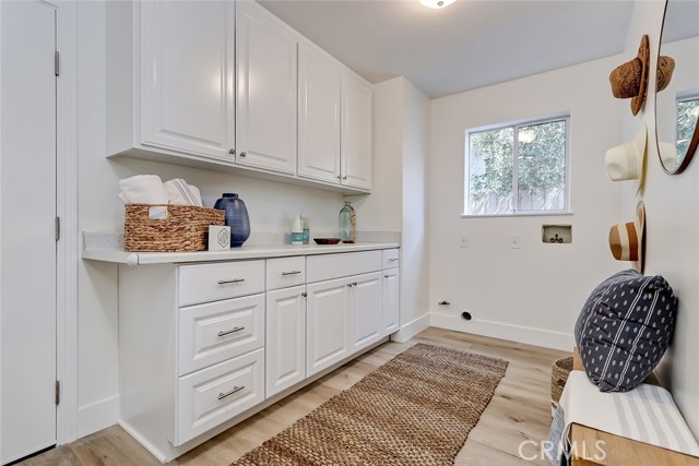 MAIN FLOOR LAUNDRY ROOM WITH DIRECT ACCESS TO 2 CAR ATTACHED GARAGE