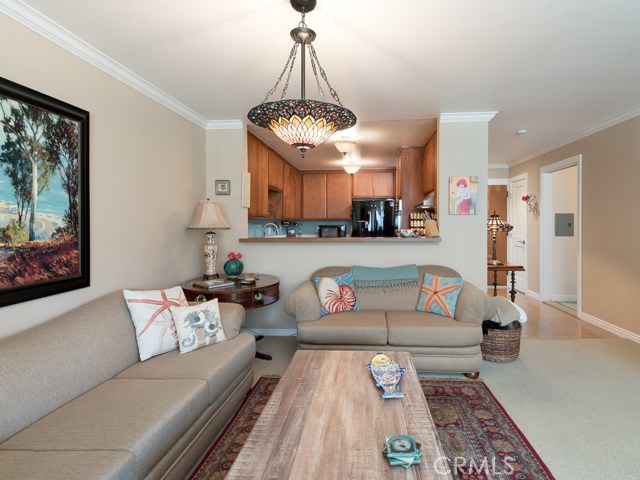 Living and dining spaces can be swapped as desired.  This area that is currently used as a living room can be used a dining area instead. Kitchen bar can also be used as secondary dining area.