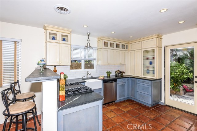 Home has great flow for entertaining from great room to generous outdoor area.  Area to right of door is a wall of cabinets that leads to guest bathroom.