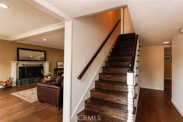 Beautifully refinished hardwood floor staircase beckons you upstairs