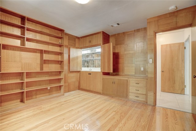 The wet bar cabinet is a well lit space.