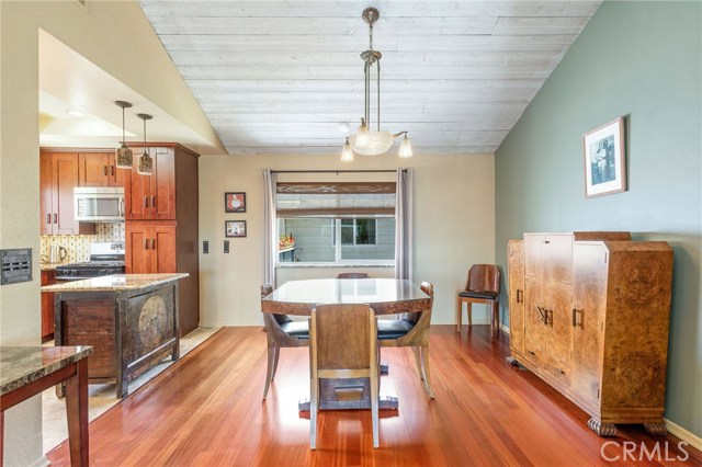 Formal dining room has vaulted ceilings.