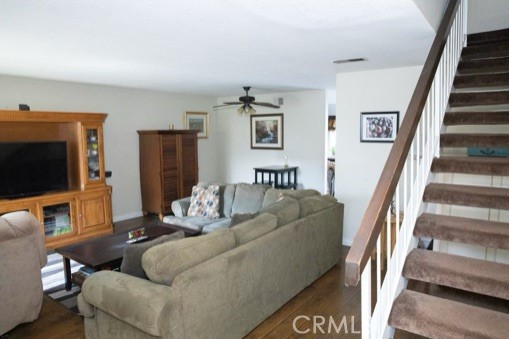 Spacious Living Room with smooth ceilings and wood floors.