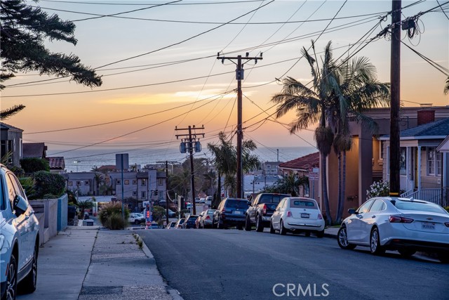 Step outside onto the sidewalk and see the ocean.