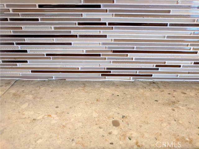 Glass Tile Back Splash with Quartz Counter Tops