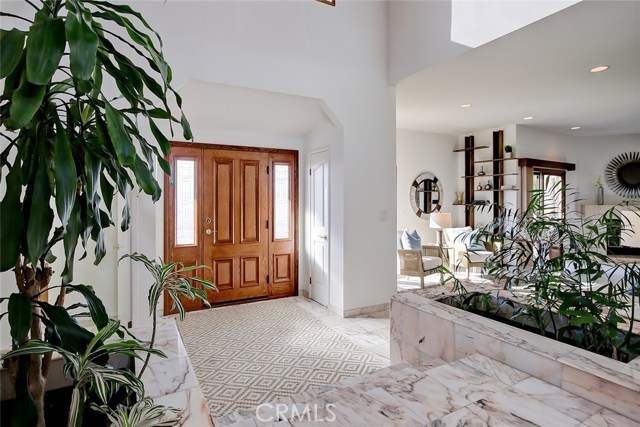 Foyer, Living Room is seen to the right.