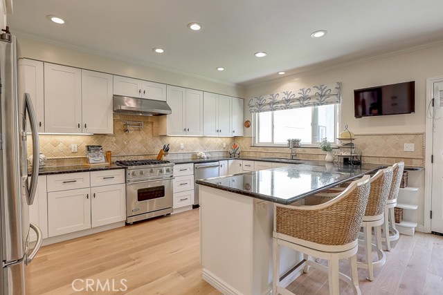 Exhibition Chef's Kitchen opening to backyard and Family room!