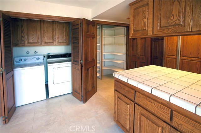 Kitchen/Eating Area with large Walk-in Pantry and Laundry Area.