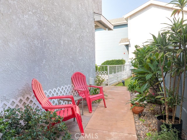 Another view of the side yard leading to the front door.