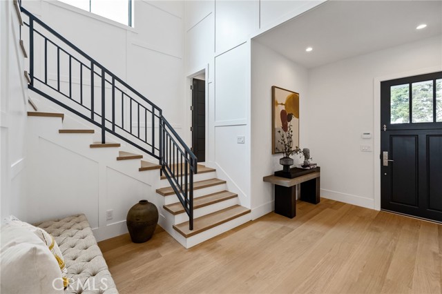 Wide plank European hard wood flooring and carefully crafted wood paneled accents