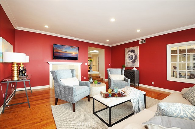 Note the third stone surround on the living room fireplace.