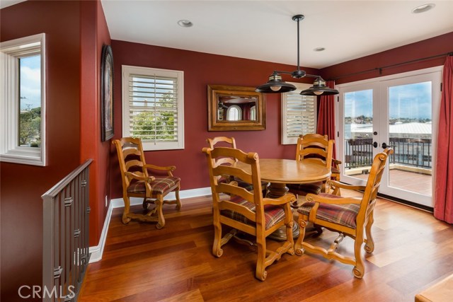 Dining area with French doors that open to the terrace with views of DTMB, Palos Verdes, and the ocean.