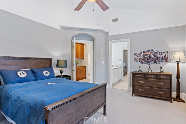 Bedroom 2 with vaulted ceilings - view toward adjoining bath to bedroom 3.