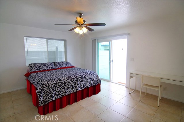 Large forth bedroom on bottom floor with sliders to private patio.