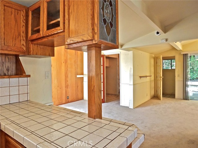 Overlooking the breakfast bar in the kitchen to the family breakfast room and den.