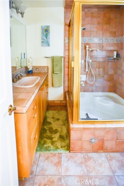 Upstairs master bath with Italian tile and sit down bath shower enclosure. For you old school classic fans the tub is from the original construction. We remodeled the bathroom around it so as to preserve the character of the home as best we could.