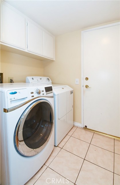 Laundry room downstairs next to garage Laundry room downstairs next to garage
