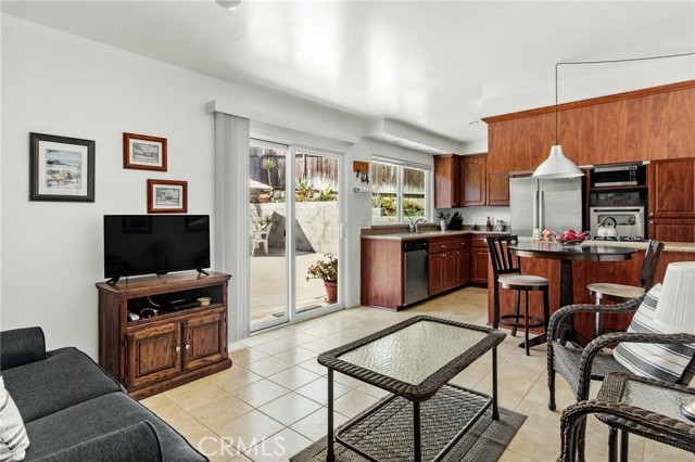 Family room is open to kitchen and nook area. Sliders lead to backyard and patio.