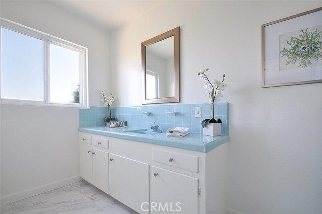 Master bathroom, freshly painted with new flooring.