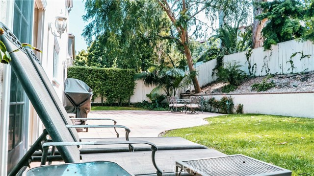 Backyard patio with 2 entrances into the house