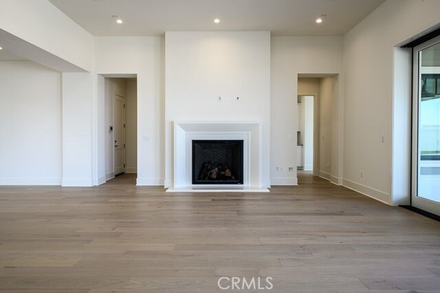 Great room with grand fireplace in Chadmar's C1 floorplan.
