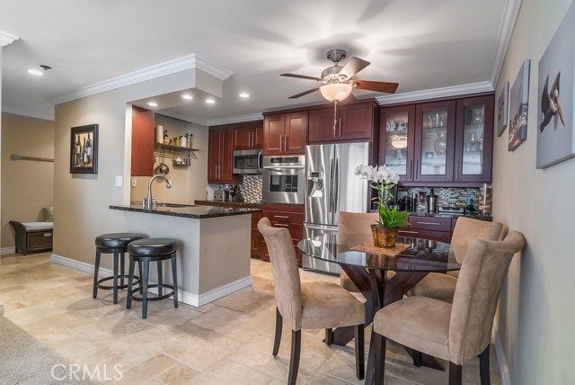 Custom built kitchen with travertine floors, floor heater, Bosch dishwasher, Thermador oven, 
Frigidaire washer & dryer, Samsung refrigerator, microwave and tv.