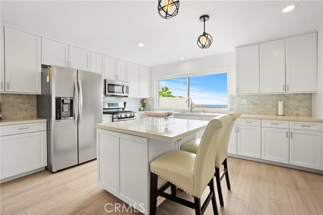 Eat-in kitchen with stainless appliances