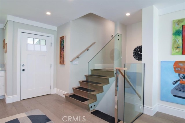 New modern glass, steel and wood railing installed with childproof glass protectant!
