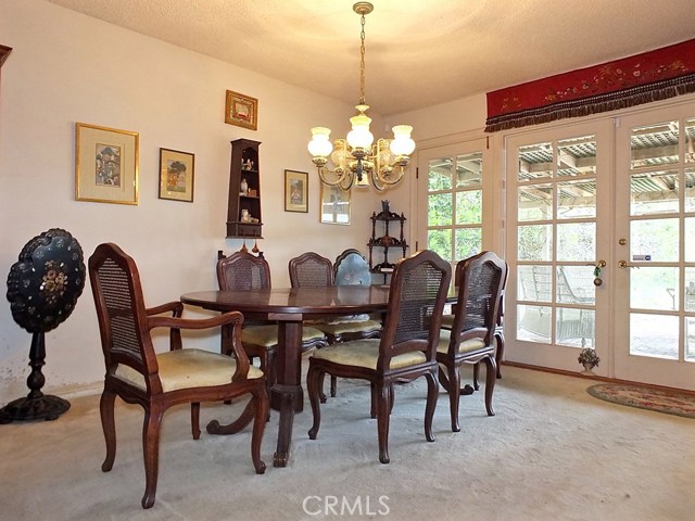 Dining Area with French Doors opening to Huge Backyard